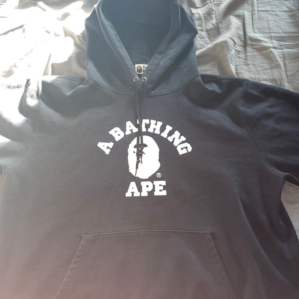Black bape hoodie with cut off sleeves.  Dry good condition.